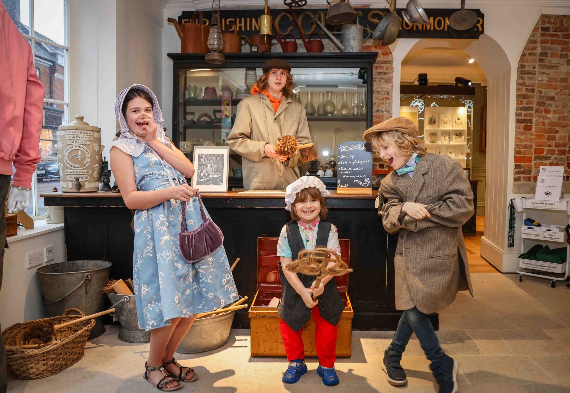A photo of four youngsters in the recreated hardware shop.